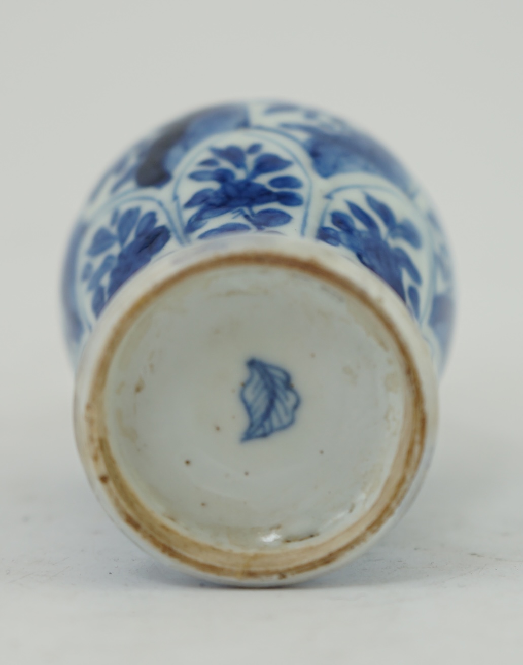 A Chinese small blue and white, white metal mounted vase, Kangxi, 12cm. Condition - poor to fair